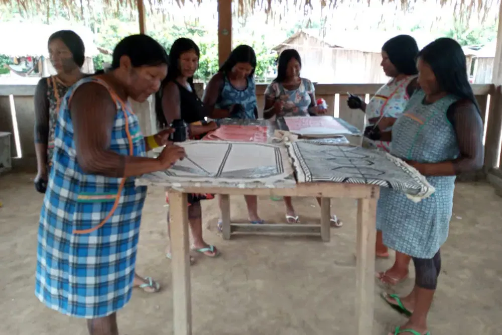 Women gathered in a handicraft workshop