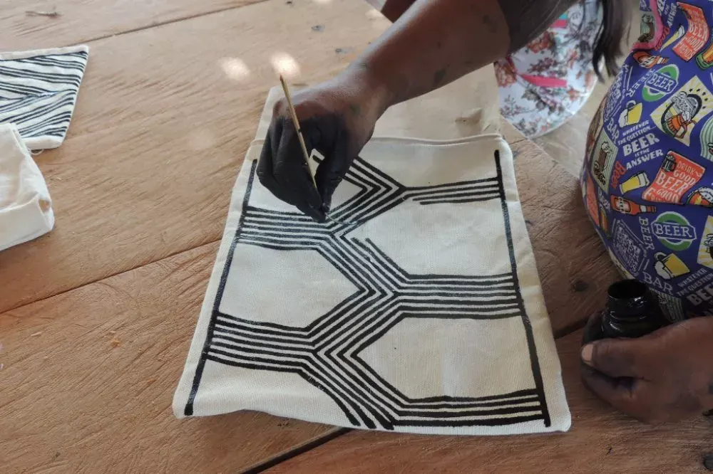 Fabric bag with a painted graphic pattern
